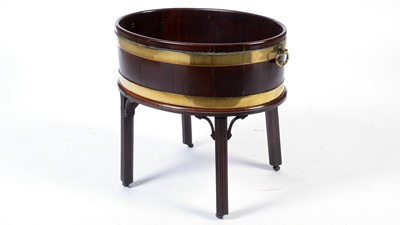 Lot 1073 - A George III mahogany and brass bound wine cooler.