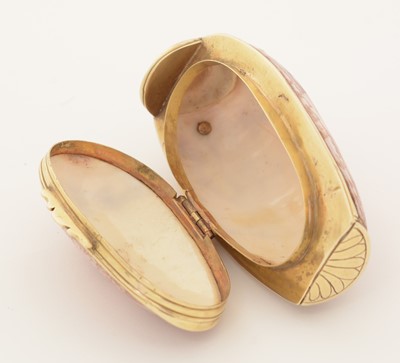 Lot 290 - A late 18th Century gold-mounted natural shell snuff box.
