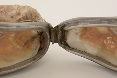 Lot 317 - A late 19th Century pewter-mounted oyster shell snuff box, and another.