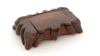 Lot 331 - A 19th Century carved wooden snuff box.