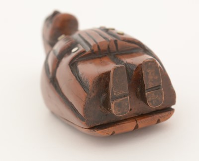 Lot 369 - A 19th Century Continental carved coquilla nut snuff box.