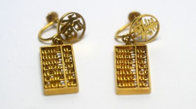 Lot 133 - A pair of Chinese 14ct yellow gold abacus pattern drop earrings