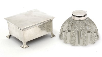 Lot 384 - A late Victorian silver-mounted cut glass inkwell; and a silver cigarette box.