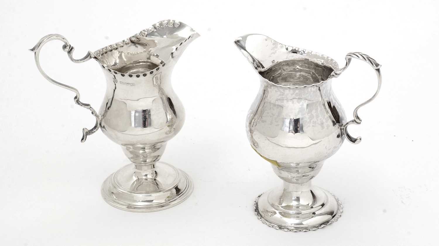 Lot 132 - A George III silver cream jug; and another.