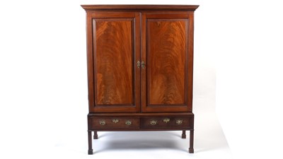 Lot 1127 - 19th Century mahogany clothes press/wardrobe on stand