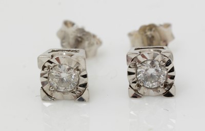 Lot 514 - A pair of diamond stud earrings