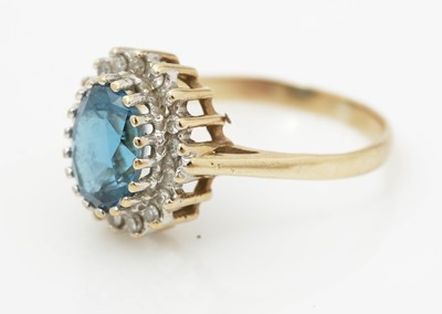 Lot 515 - A topaz and diamond cluster ring