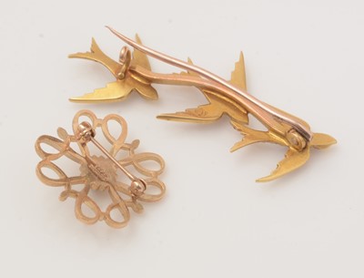 Lot 150 - Three Edwardian gold brooches, and a costume brooch.