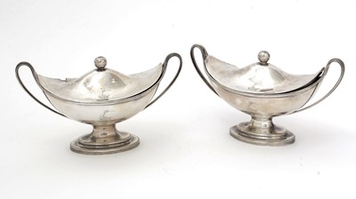 Lot 205 - A pair of George III silver sauce tureens and covers.