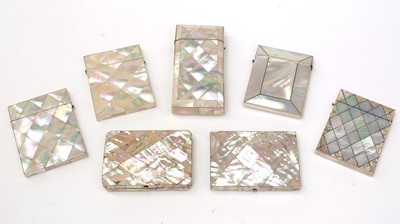 Lot 411 - Six various early Victorian mother-of-pearl card cases; and a cheroot case.