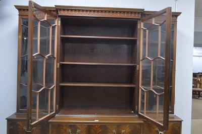Lot 103 - Frederick Tibbenham Ltd., Ipswich: a Georgian-style repro breakfront bookcase.
