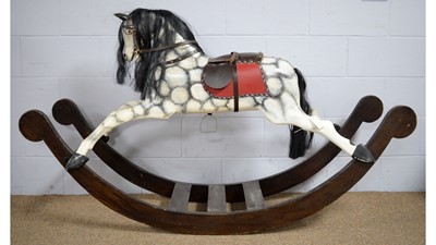 Lot 3 - A vintage hand-carved wooden dapple-grey rocking horse.