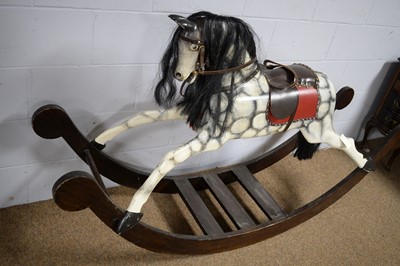 Lot 3 - A vintage hand-carved wooden dapple-grey rocking horse.