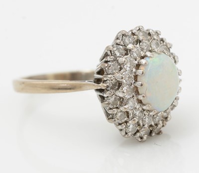 Lot 521 - An opal and diamond cluster ring