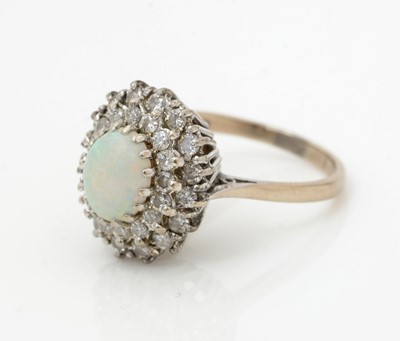 Lot 521 - An opal and diamond cluster ring