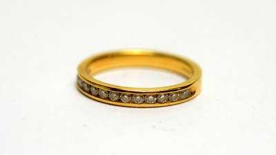 Lot 141 - A twelve stone diamond half hoop eternity ring