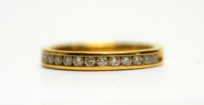 Lot 141 - A twelve stone diamond half hoop eternity ring