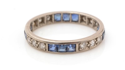 Lot 132 - A sapphire and diamond eternity ring