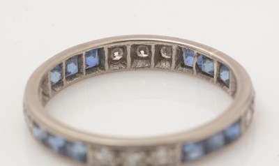 Lot 132 - A sapphire and diamond eternity ring