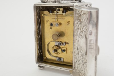 Lot 402 - An Edwardian silver boudoir timepiece.