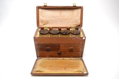 Lot 214 - An early 20th Century leather travelling vanity case and contents.