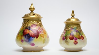 Lot 891 - Two Royal Worcester pot pourri vases and covers by Kitty Blake