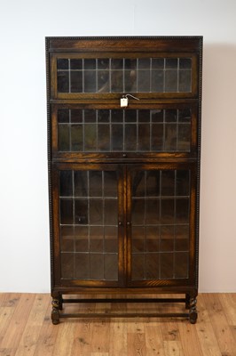 Lot 62 - An early 20th century oak glazed bookcase