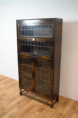 Lot 62 - An early 20th century oak glazed bookcase