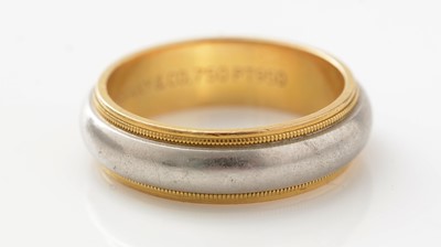 Lot 493 - Tiffany & Co: a platinum and 18ct yellow gold band ring