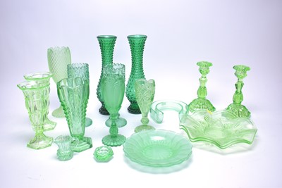 Lot 376 - A collection of North East pressed green glass ware.