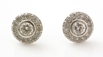 Lot 435 - A pair of diamond cluster earrings