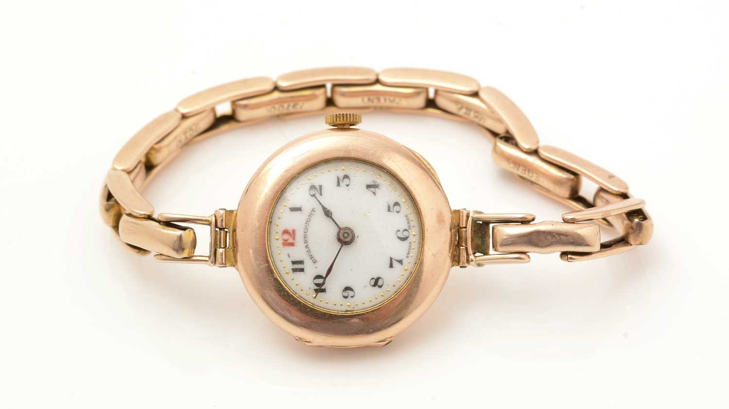 Lot 101 - A 9ct yellow gold cased wristwatch, the white enamel arabic dial marked Dreadnought