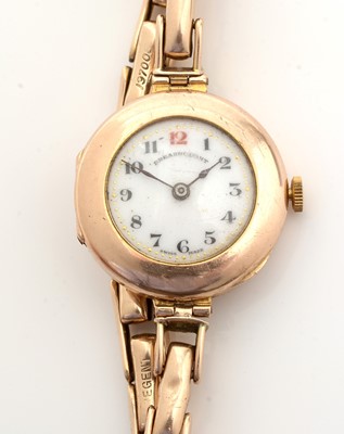 Lot 101 - A 9ct yellow gold cased wristwatch, the white enamel arabic dial marked Dreadnought