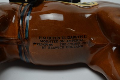 Lot 411 - A pair of Beswick figures of H.M. Queen Elizabeth II, and H.R.H. The Duke of Edinburgh.