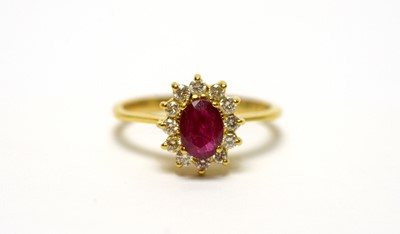 Lot 127 - A ruby and diamond cluster ring