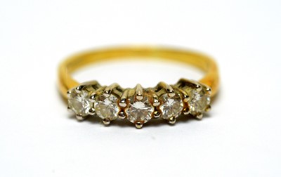 Lot 129 - A five-stone diamond ring