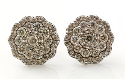Lot 505 - A pair of diamond earrings