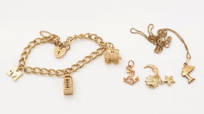 Lot 115 - A 9ct yellow gold charm bracelet