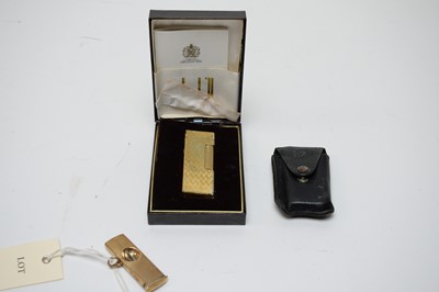 Lot 233 - A 9ct yellow gold mounted cigar cutter, and a gilt metal Dunhill lighter
