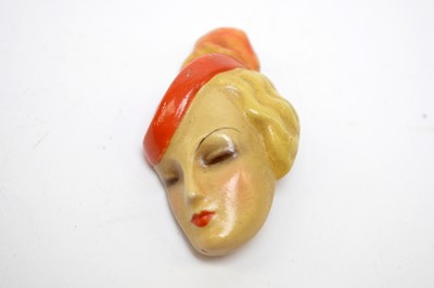 Lot 16 - Two 1930s "fabulous faces" brooches including silver screen star Marlene Dietrich