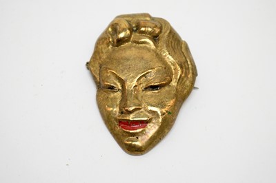 Lot 16 - Two 1930s "fabulous faces" brooches including silver screen star Marlene Dietrich