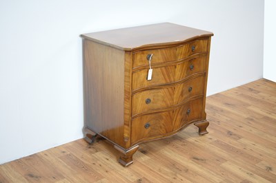 Lot 23 - An early 20th Century serpentine mahogany chest of drawers