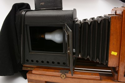 Lot 1 - An Edwardian Thornton Pickard folding Magic Lantern with slides