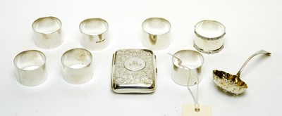 Lot 1234 - A selection of small silver items, including a George V cigarette case and napkin rings