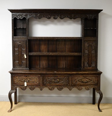 Lot 66 - A 19th Century carved oak dresser
