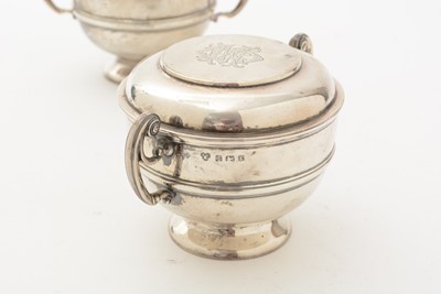 Lot 70 - A matched pair of Edwardian George V silver two handled cups