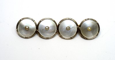 Lot 176 - A pair of 18ct yellow and white gold, mother of pearl and seed pearl cufflinks