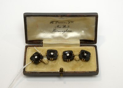 Lot 177 - A pair of French cufflinks of onyx, white sapphires and yellow gold