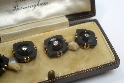 Lot 177 - A pair of French cufflinks of onyx, white sapphires and yellow gold