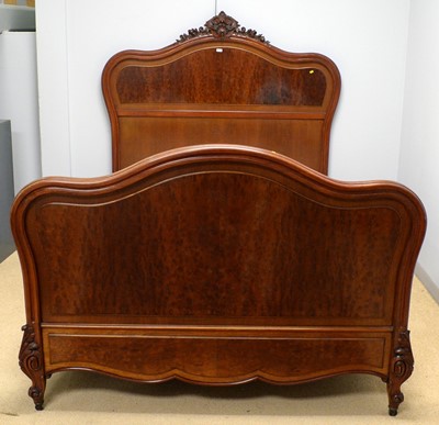 Lot 72 - A 20th Century French carved hardwood double bed